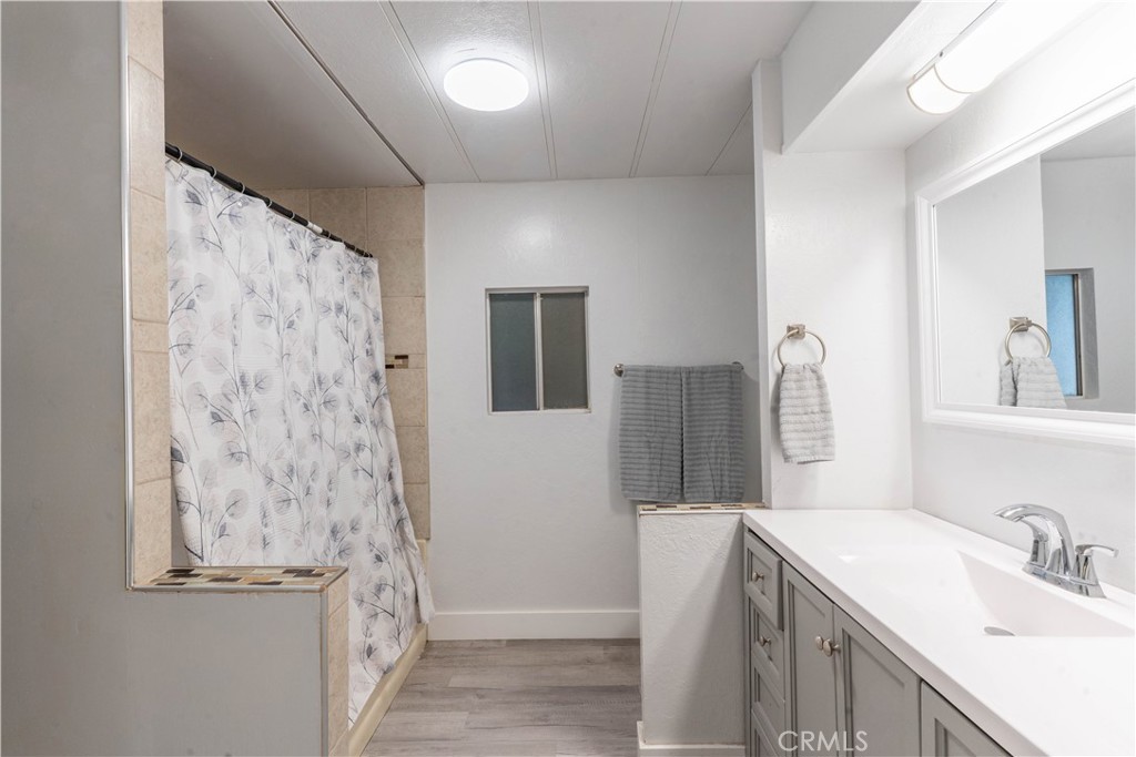 251 South Colorado River Road, Unit 38 Blythe, CA 92225 - Photo 14 of 19 a bathroom with a sink and a mirror