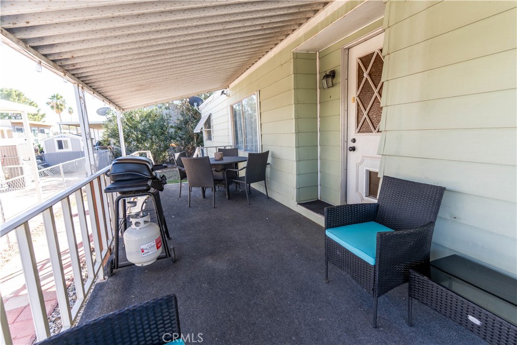 251 South Colorado River Road, Unit 38 Blythe, CA 92225 - Photo 18 of 19 a view of a patio with chairs and a table