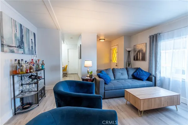 a living room with furniture and a table