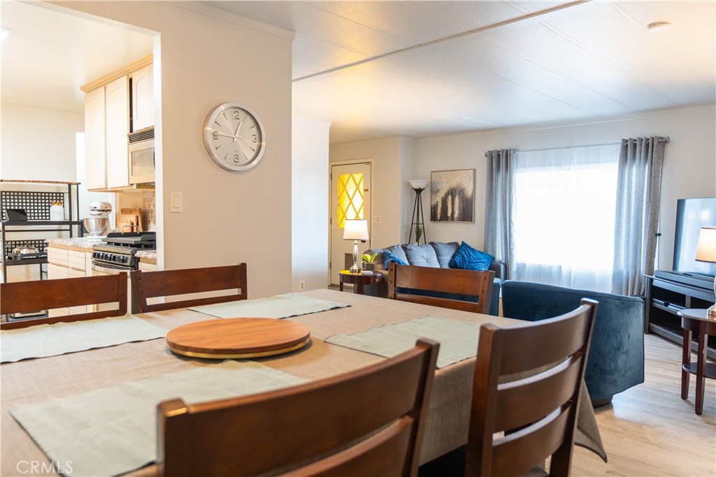 251 South Colorado River Road, Unit 38 Blythe, CA 92225 - Photo 5 of 19 a living room with furniture and a large window