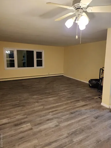 a view of a livingroom with a flat screen tv