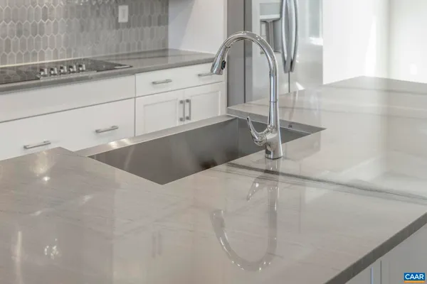 a kitchen with a sink and cabinets