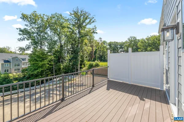 a view of a balcony with wooden floor