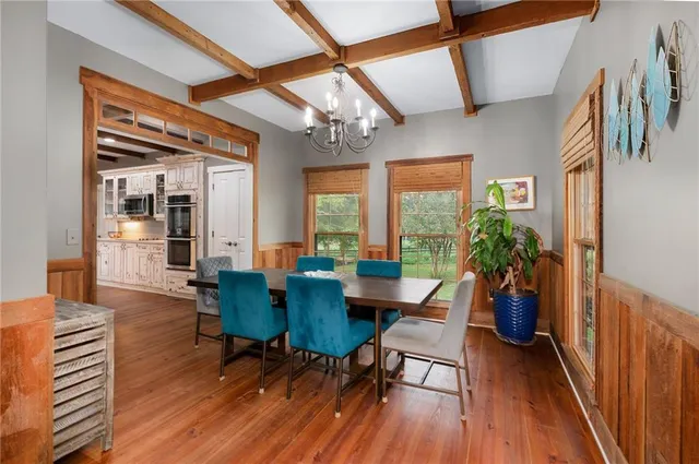 a kitchen with stainless steel appliances granite countertop a sink and a refrigerator