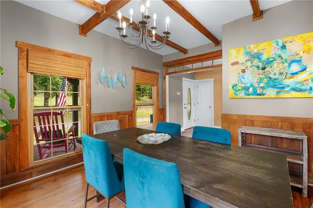 a kitchen with stainless steel appliances granite countertop a stove microwave and cabinets