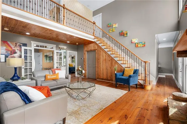 a bathroom with a double vanity sink mirror and bathtub