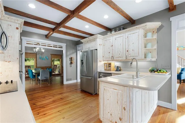 a living room with furniture and a lamp