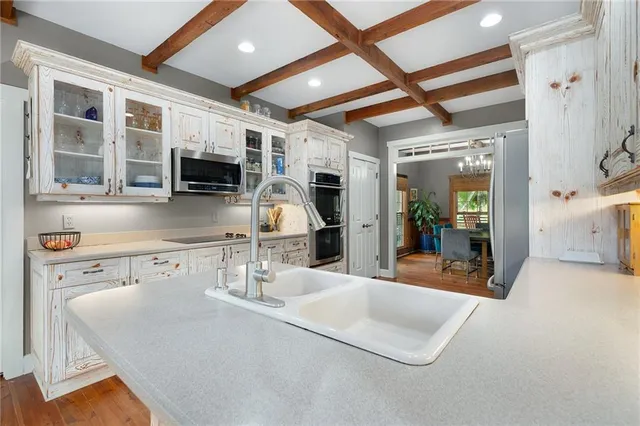 a bathroom with a sink vanity granite and toilet