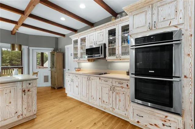 a room with wooden floor and furniture