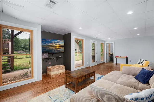 a view of empty room with wooden walls