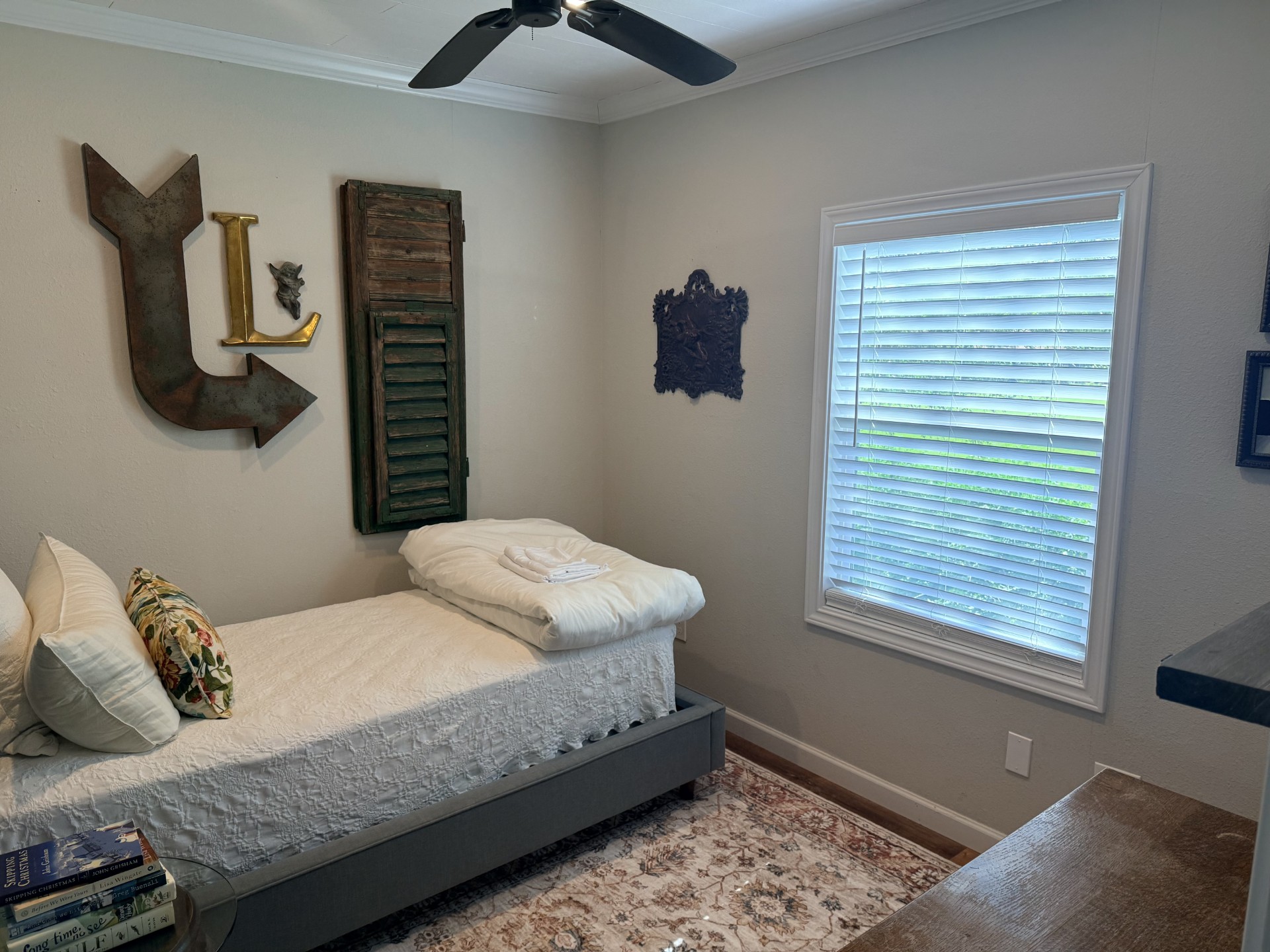 227 Crooked Hollow Road Elgin, TX 78621 - Photo 8 of 11 a bedroom with a bed and dresser