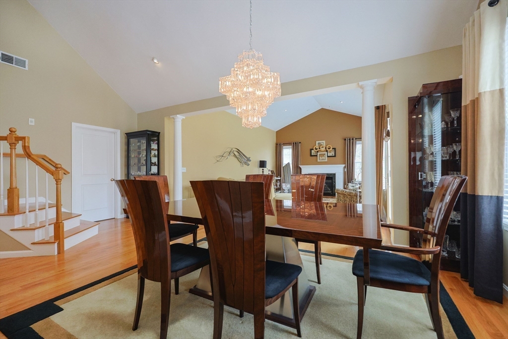 14 Codding Road, Unit 65 Norton, MA 02766 - Photo 12 of 30 a view of a dining room with furniture window and wooden floor