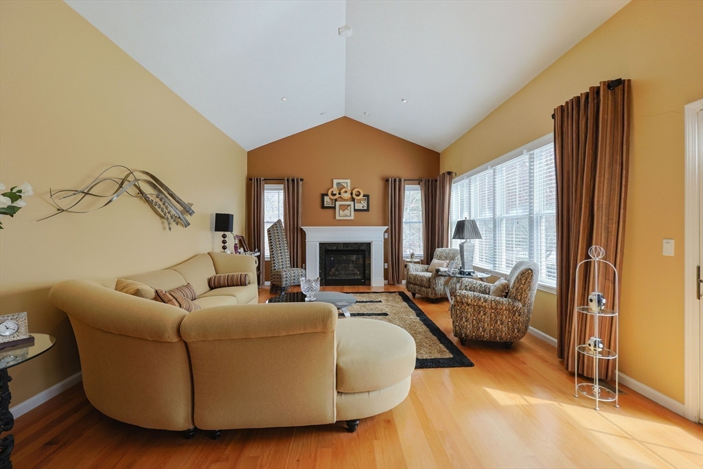 14 Codding Road, Unit 65 Norton, MA 02766 - Photo 13 of 30 a living room with furniture and a fireplace
