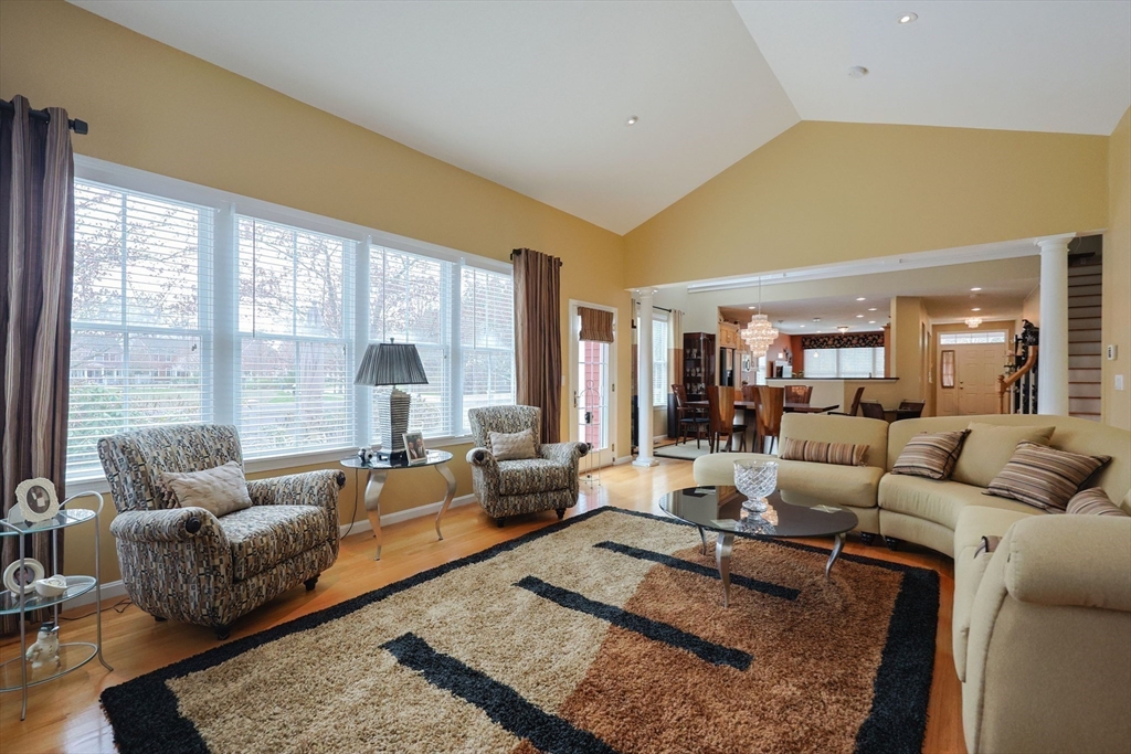 14 Codding Road, Unit 65 Norton, MA 02766 - Photo 15 of 30 a living room with furniture wooden floor and a large window
