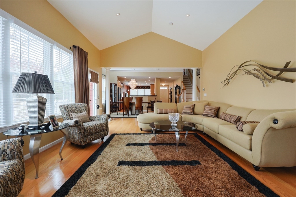 14 Codding Road, Unit 65 Norton, MA 02766 - Photo 16 of 30 a living room with furniture and a lamp