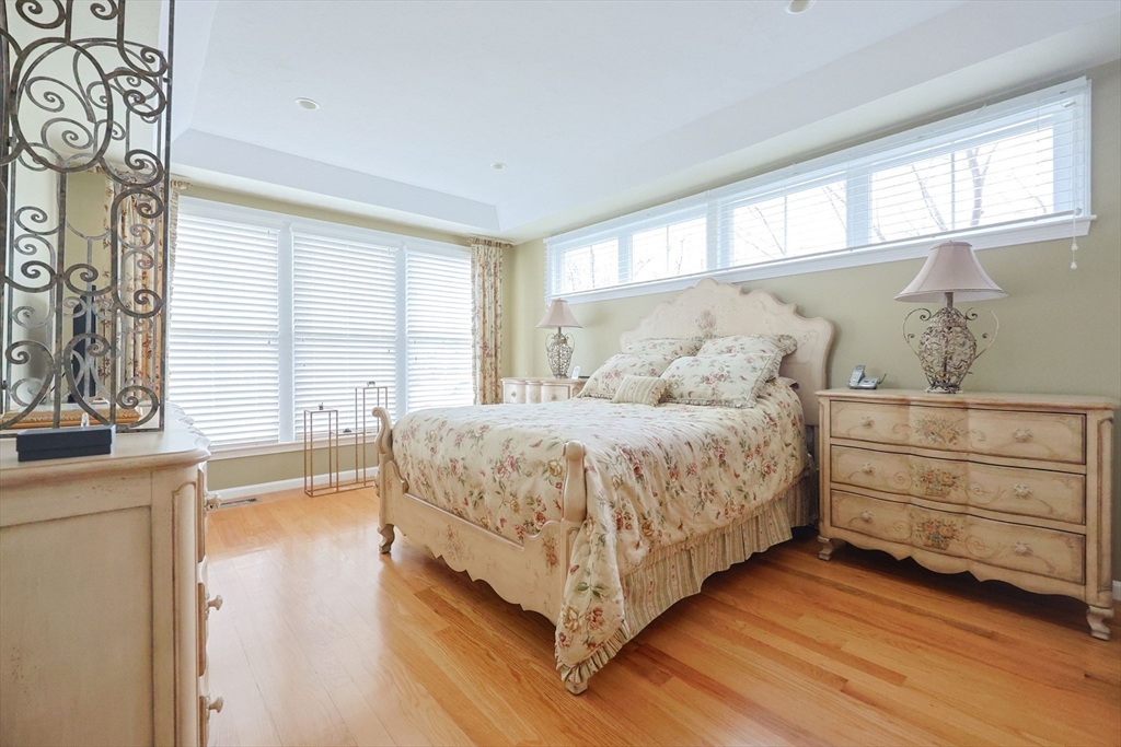 14 Codding Road, Unit 65 Norton, MA 02766 - Photo 17 of 30 a bed room with a bed and a large window