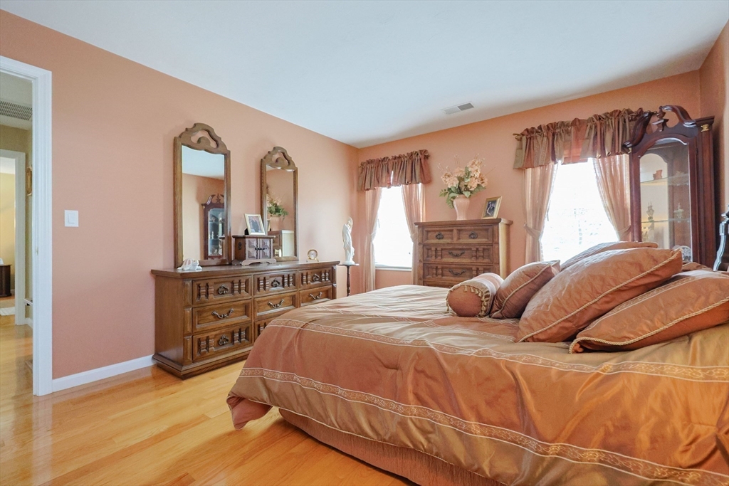 14 Codding Road, Unit 65 Norton, MA 02766 - Photo 19 of 30 a bedroom with a bed and a dresser