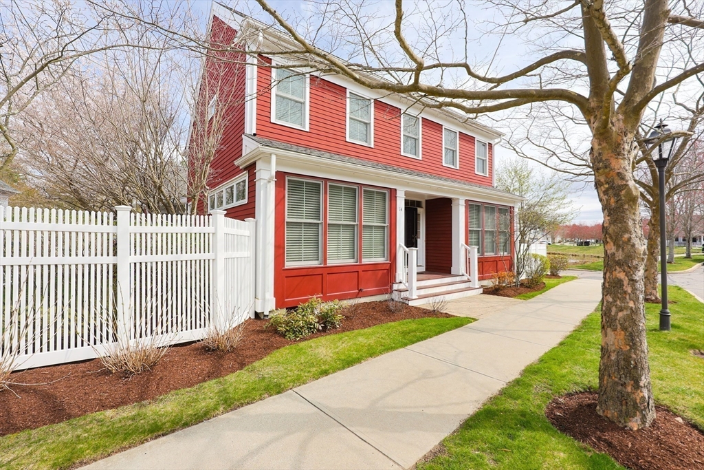 14 Codding Road, Unit 65 Norton, MA 02766 - Photo 21 of 30 a front view of a house with a yard and table and chairs