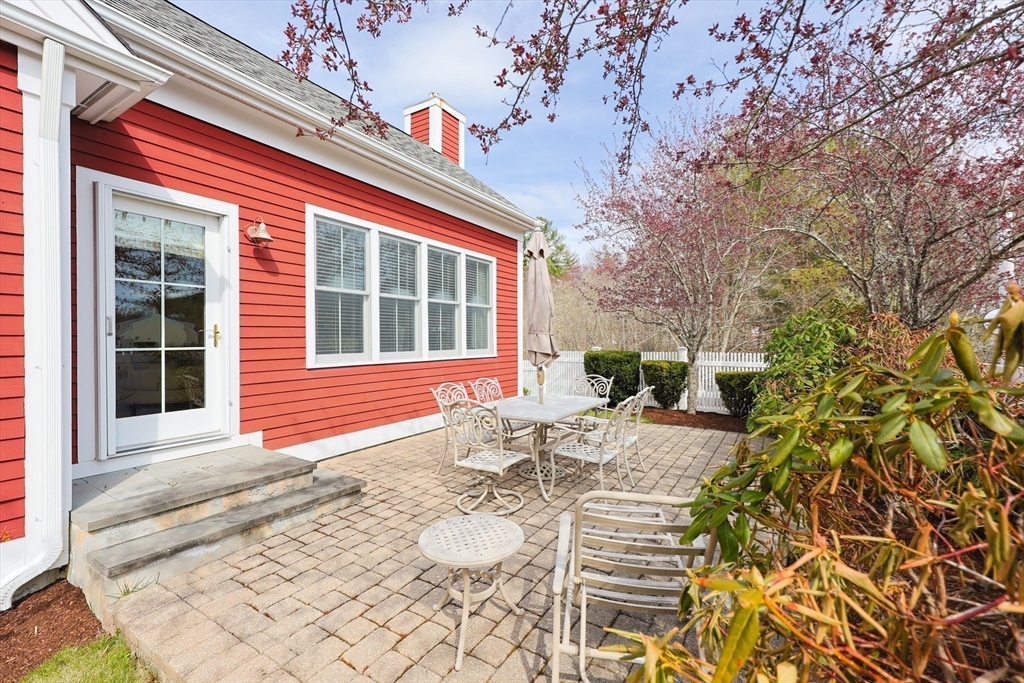 14 Codding Road, Unit 65 Norton, MA 02766 - Photo 22 of 30 a view of house with backyard and sitting area