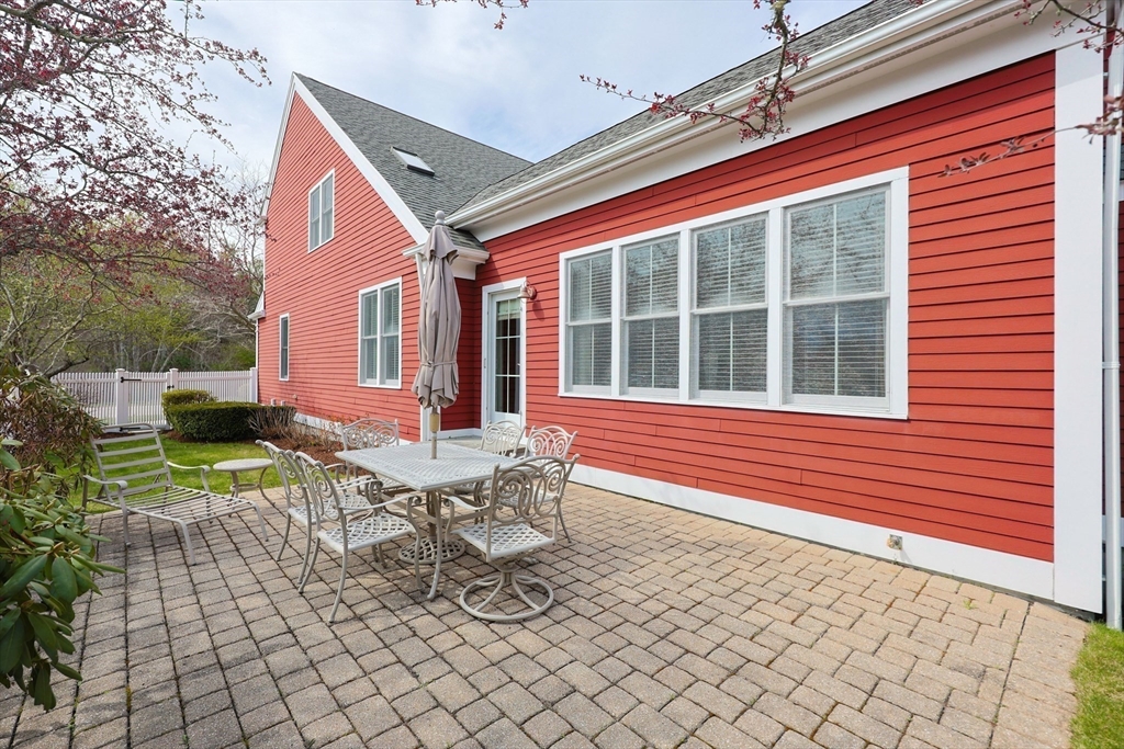 14 Codding Road, Unit 65 Norton, MA 02766 - Photo 23 of 30 a view of a house with backyard and sitting area