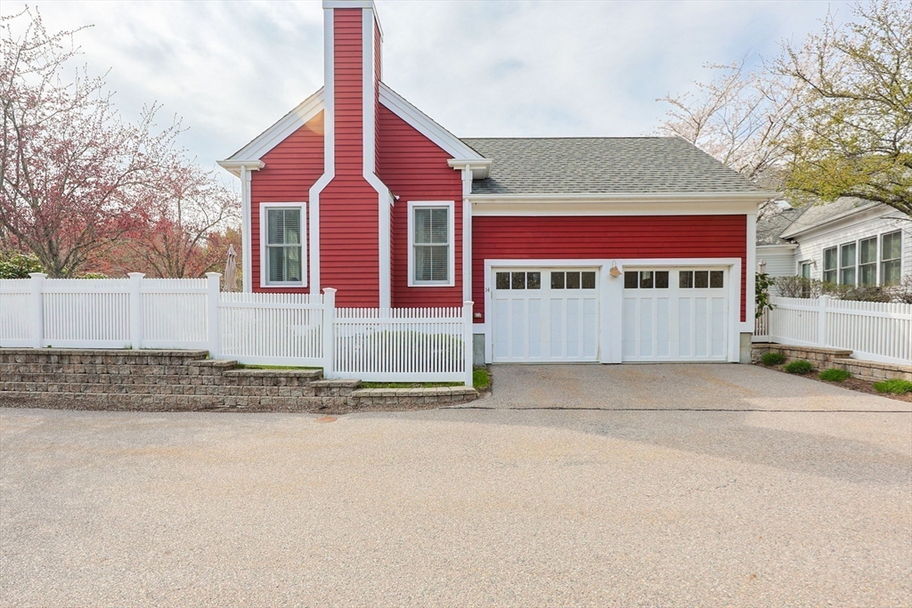 14 Codding Road, Unit 65 Norton, MA 02766 - Photo 26 of 30 a front view of a house with a yard