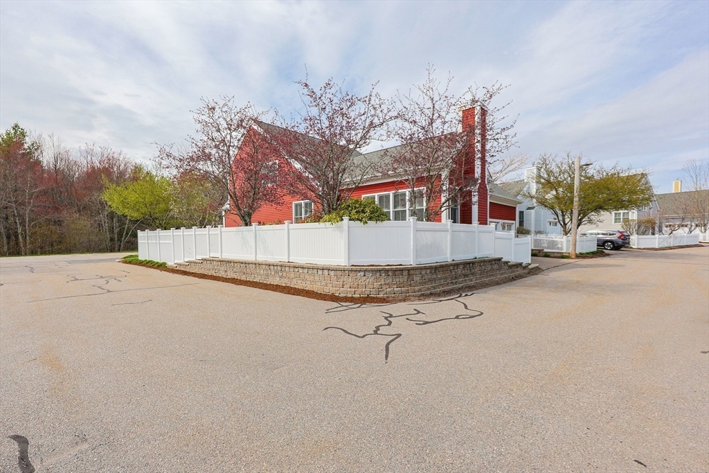 14 Codding Road, Unit 65 Norton, MA 02766 - Photo 28 of 30 a view of a street with houses