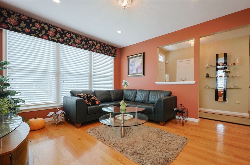 14 Codding Road, Unit 65 Norton, MA 02766 - Photo 8 of 30 a living room with furniture and wooden floor