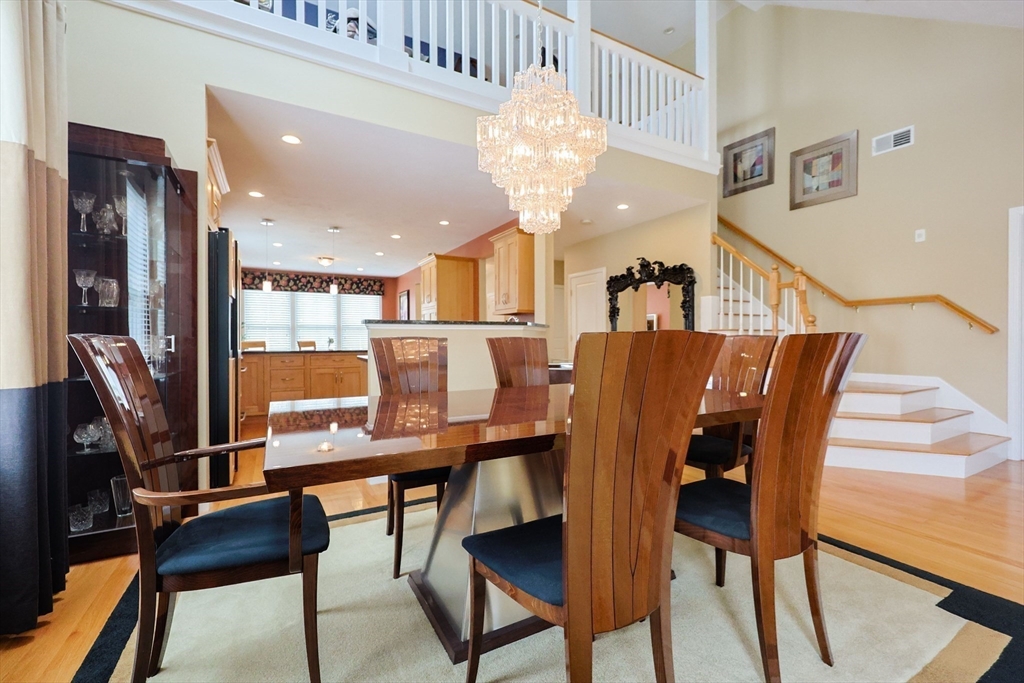 14 Codding Road, Unit 65 Norton, MA 02766 - Photo 9 of 30 a view of a dining room with furniture and a chandelier