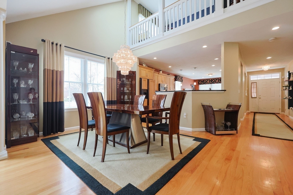 14 Codding Road, Unit 65 Norton, MA 02766 - Photo 10 of 30 a view of a dining room with furniture and wooden floor
