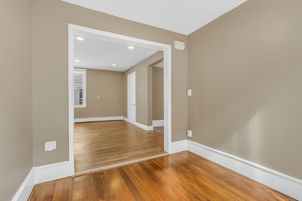18 School Street, Unit 2 Boston, MA 02119 - Photo 11 of 23 a view of empty room with wooden floor
