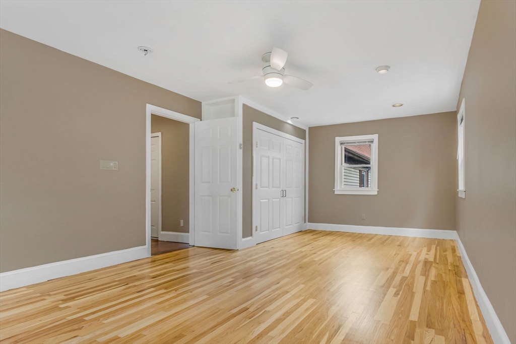 18 School Street, Unit 2 Boston, MA 02119 - Photo 14 of 23 a view of an empty room with wooden floor
