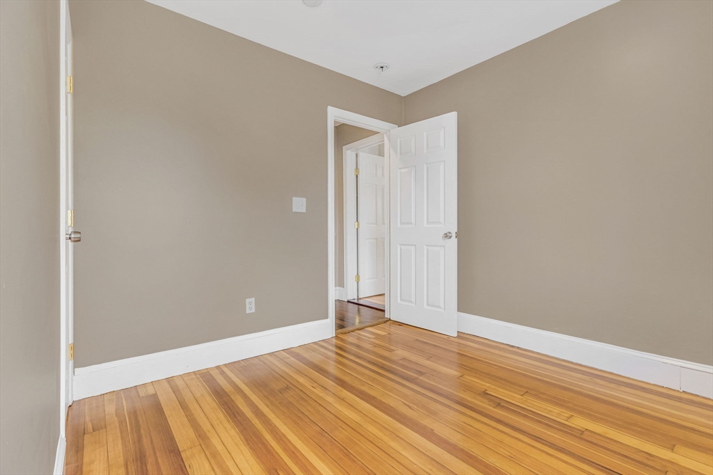 18 School Street, Unit 2 Boston, MA 02119 - Photo 18 of 23 a view of a room with wooden floor