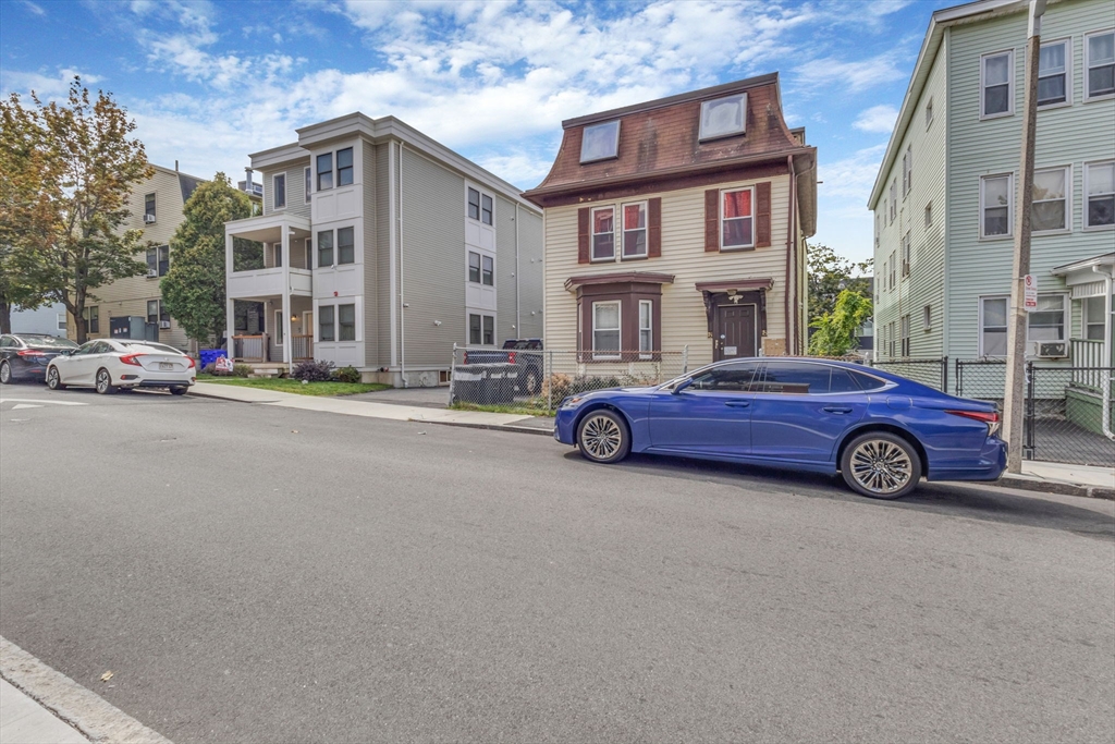 18 School Street, Unit 2 Boston, MA 02119 - Photo 2 of 23 a car parked in front of a building