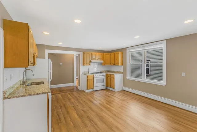a view of a kitchen cabinets and wooden floor