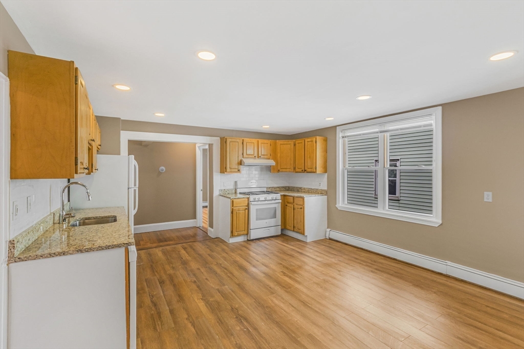 18 School Street, Unit 2 Boston, MA 02119 - Photo 9 of 23 a view of a kitchen cabinets and wooden floor