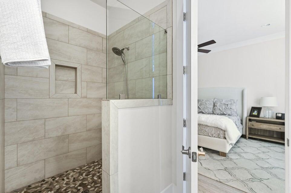 995 Airport Road, Unit 13 Destin, FL 32541 - Photo 16 of 32 a en suite bathroom with a shower