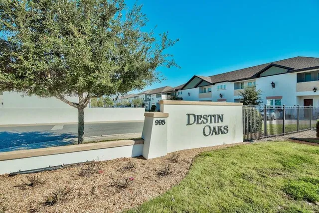 a view of a sign board with yard