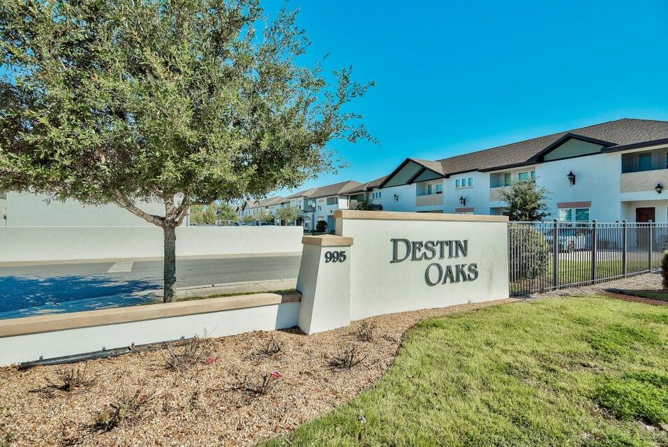 995 Airport Road, Unit 13 Destin, FL 32541 - Photo 2 of 32 a view of a sign board with yard