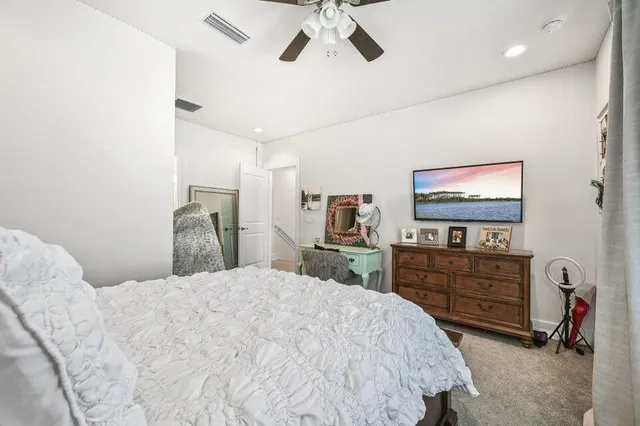 a view of house with yard and sitting area