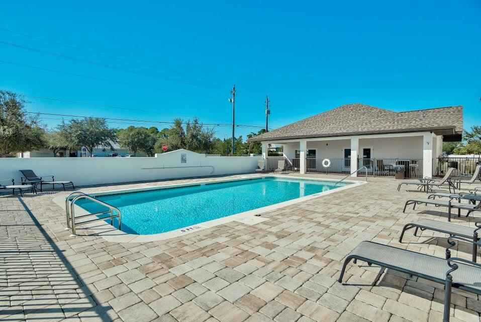 995 Airport Road, Unit 13 Destin, FL 32541 - Photo 30 of 32 a view of house with yard and sitting area