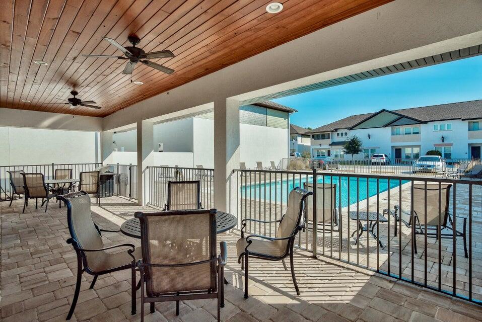 995 Airport Road, Unit 13 Destin, FL 32541 - Photo 32 of 32 a view of a chairs and table in patio