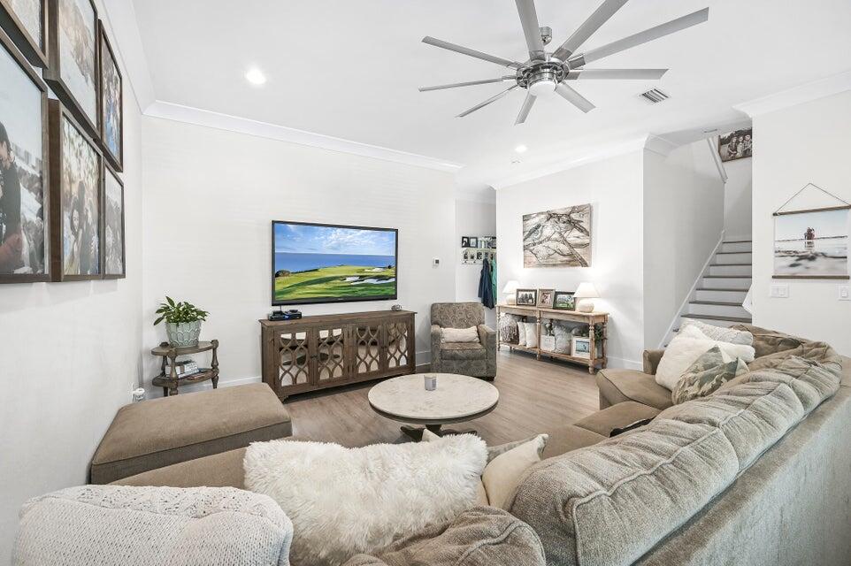 995 Airport Road, Unit 13 Destin, FL 32541 - Photo 5 of 32 a living room with furniture and a flat screen tv