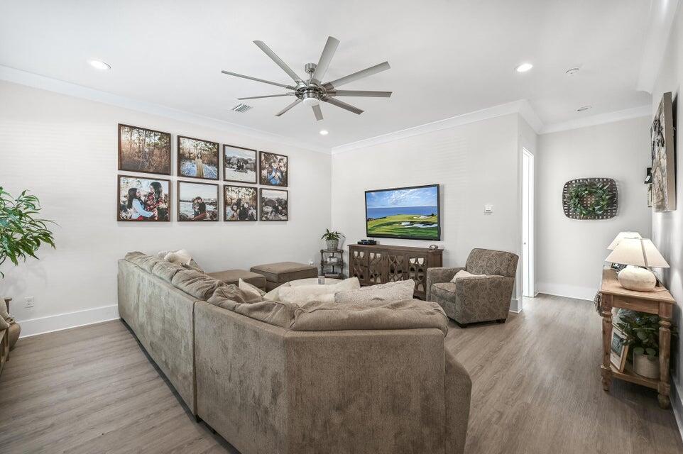 995 Airport Road, Unit 13 Destin, FL 32541 - Photo 6 of 32 a living room with furniture and wooden floor