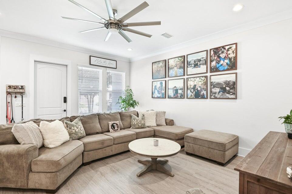 995 Airport Road, Unit 13 Destin, FL 32541 - Photo 7 of 32 a living room with furniture and a large window