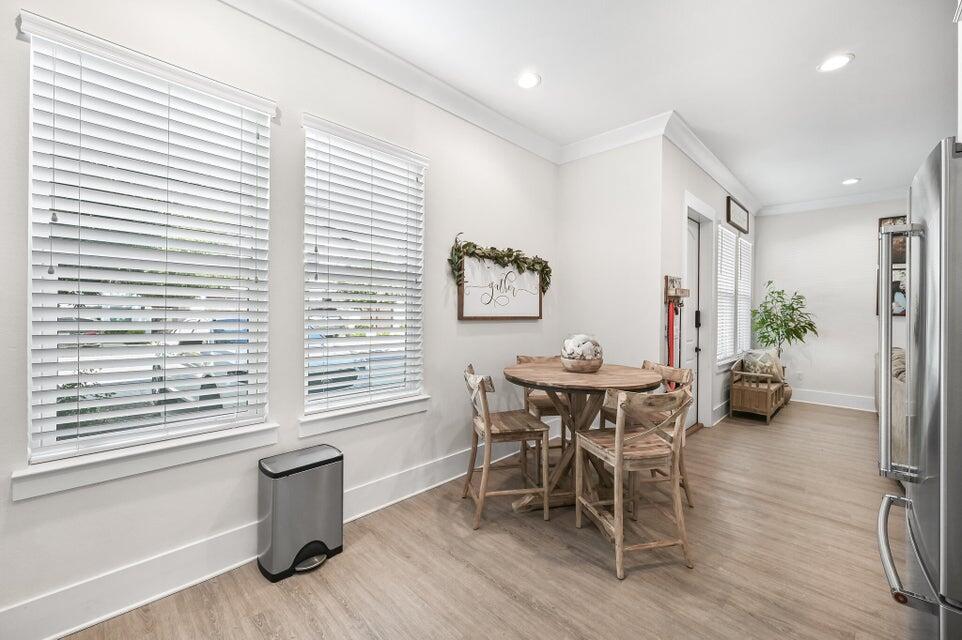 995 Airport Road, Unit 13 Destin, FL 32541 - Photo 10 of 32 a view of a dining room with furniture and chandelier
