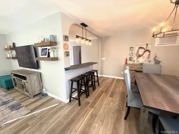a living room with furniture a fireplace and a table