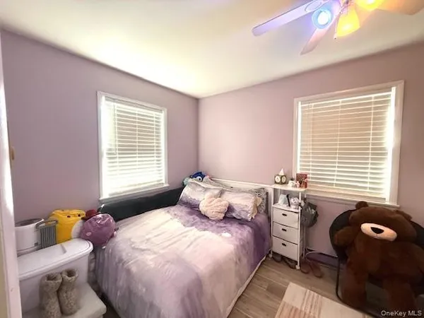 a bedroom with a bed and a mirror