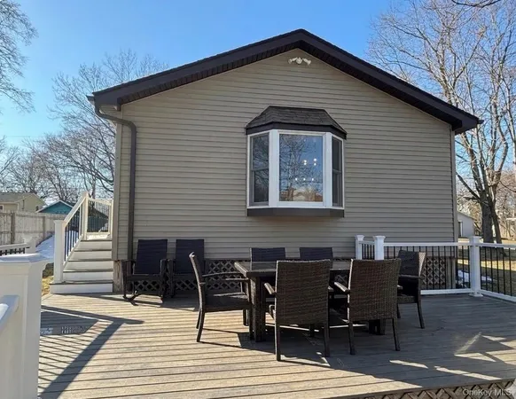 a view of a backyard with sitting area