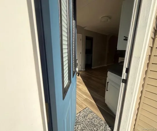 a kitchen with a refrigerator and a sink