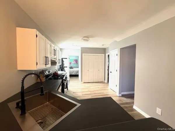 a kitchen with granite countertop a stove and a sink